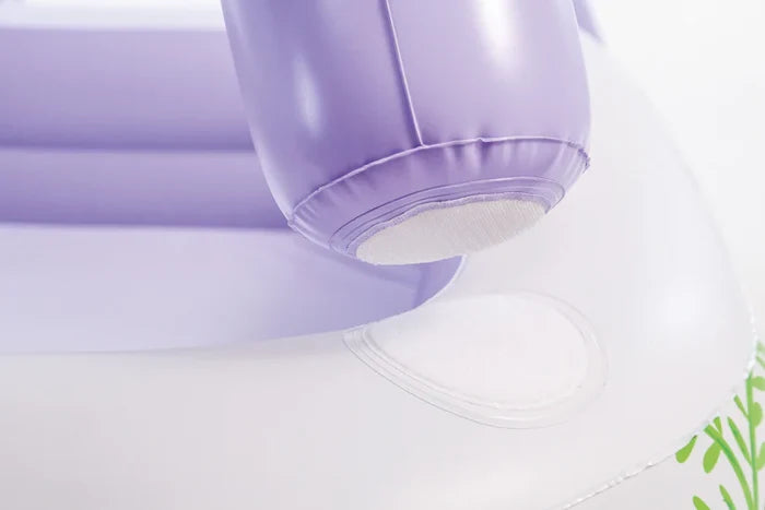 Close-up of purple inflatable column and white pool rim with circular hook-and-loop attachment patches.