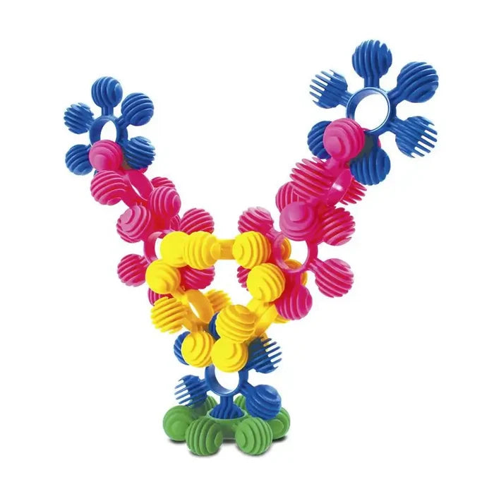 Colorful branched construction made of interlocking blue, pink, yellow, and green textured plastic rings.