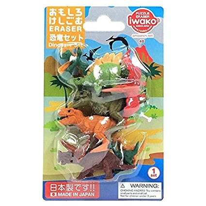 Colorful dinosaur-shaped puzzle erasers in green, orange, and brown inside a clear plastic retail blister pack.