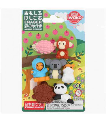 Seven colorful animal-shaped erasers including a panda and koala inside a forest-themed illustrated blister package.