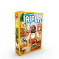 Yellow rectangular board game box with a vibrant illustration of a turbaned merchant at a marketplace with camels.
