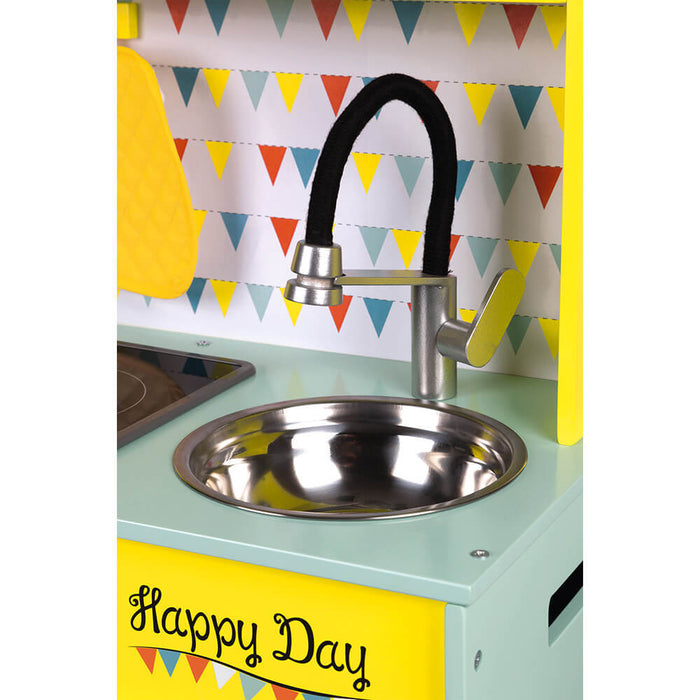 Toy kitchen sink with a curved black faucet, silver basin, and 'Happy Day' text on a bright yellow panel.