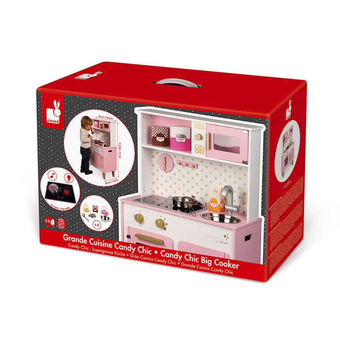 Red box featuring a pink and white wooden toy kitchen with a microwave, oven, sink, and play accessories.