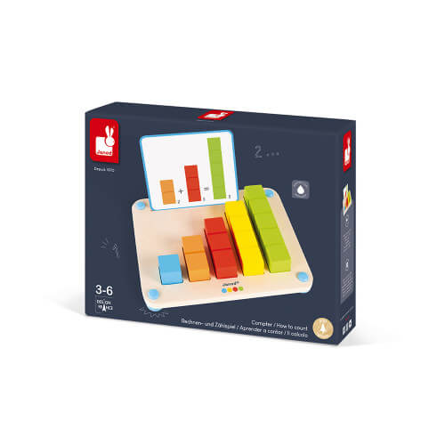 Janod educational toy box showing a wooden board with colorful blocks of varying heights and a math addition card.