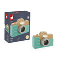 Mint green and wood toy camera with an orange button and grey lens, shown next to its dark blue illustrated box.