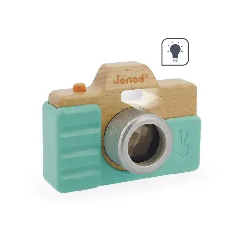 Wood and teal toy camera featuring a faceted silver lens, orange shutter button, and lightbulb function icon.