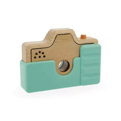 Natural wood and mint green toy camera with an orange shutter button and circular kaleidoscope lens.