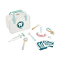 Pastel wooden toy dentist set with a white zippered bag, dental tools, model gums with teeth, and X-ray cards.
