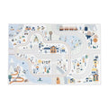 Rectangular play mat with a muted blue, grey, and yellow illustrated map of a mountain valley and town.