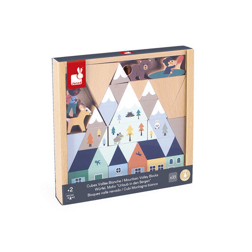 Colorful wooden building blocks with mountain, house, and animal illustrations in a light wood tray.