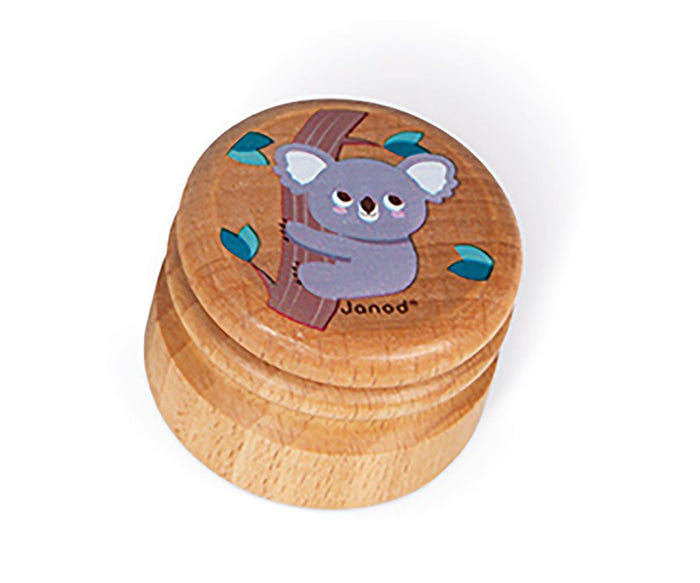 Small round wooden box with a cartoon grey koala on a tree branch illustrated on the lid.
