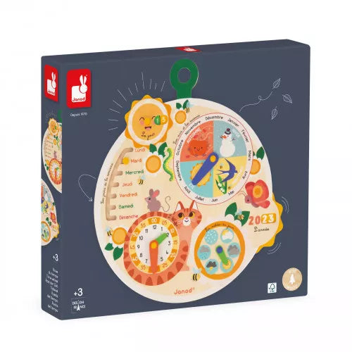 Dark grey box featuring a circular wooden calendar toy with a clock, seasonal wheel, and colorful animal illustrations.