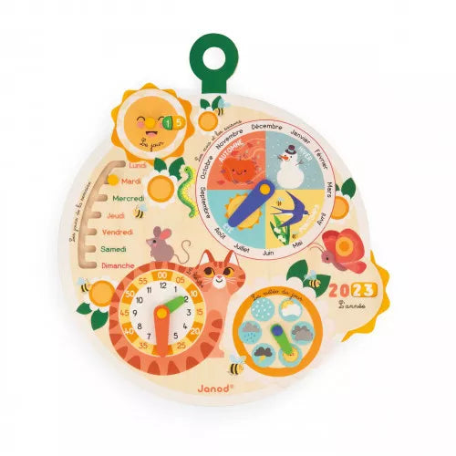 Round wooden calendar with French text, clock, season and weather dials, and bright illustrations of a cat, sun and bird.