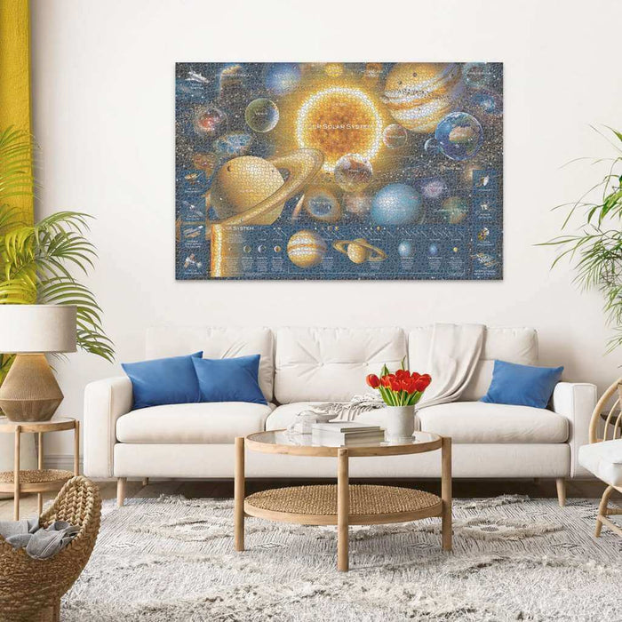 Large solar system puzzle with vibrant planets and a glowing sun, displayed on a wall above a white sofa.