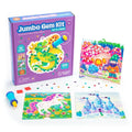 Purple craft kit box with dragon, unicorn, and castle designs, plus colorful jumbo gems and a blue applicator tool.
