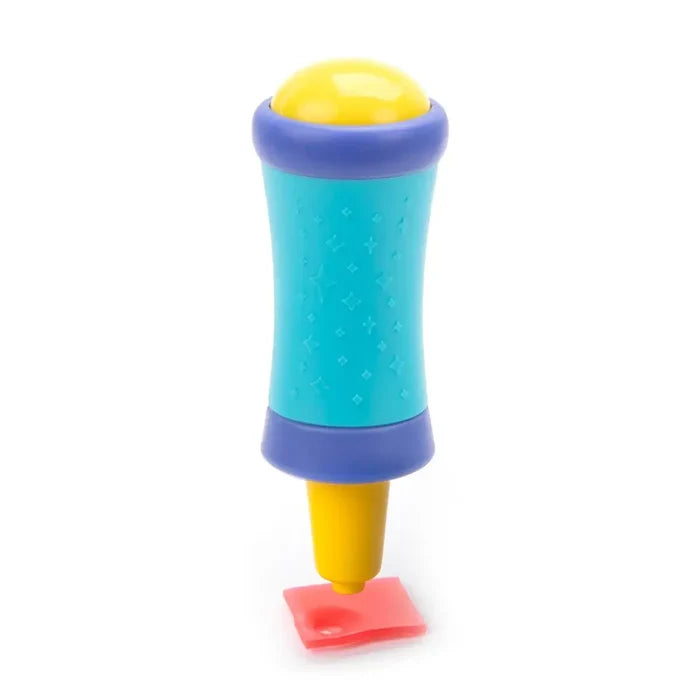 Teal and yellow gem applicator tool with star textures shown pressing into a pink square.