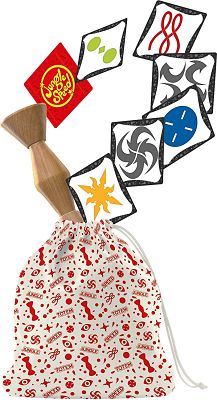 Wooden totem and cards with colorful symbols emerging from a white drawstring bag with a red patterned print.