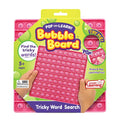 Pink silicone word search bubble board with letters, held by hands in bright green and yellow retail packaging.