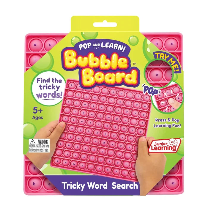 Pink silicone word search bubble board with letters, held by hands in bright green and yellow retail packaging.