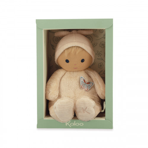 Soft peach plush baby doll with a butterfly patch and hat, sitting in a light green rectangular display box.