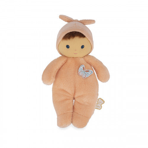 Plush peach baby doll wearing a hooded romper with a butterfly patch, blue eyes, and a small smile.
