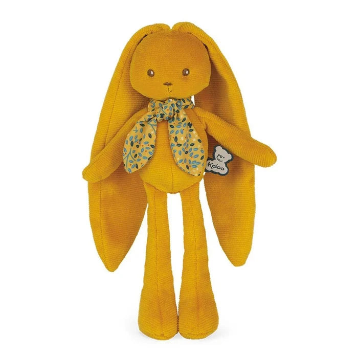 Mustard yellow corduroy plush rabbit with long ears and legs, wearing a blue and yellow leaf-patterned scarf.