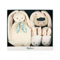 Cream bunny gift set featuring a soft plush toy, teething ring, and matching booties in a dark blue display box.