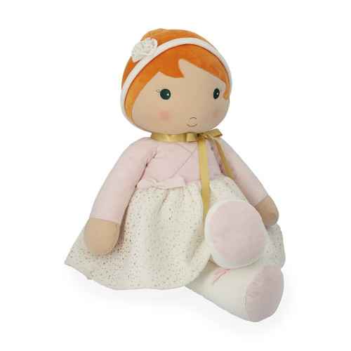Oversized plush doll with orange hair, pink wrap top, cream gold-flecked skirt, and a white flower headband.