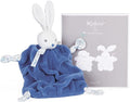 Soft blue plush rabbit comforter with a white head and patterned paws, next to its gray Kaloo branded gift box.