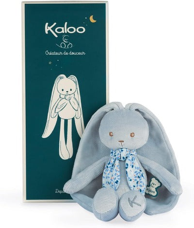 Plush light blue bunny with long ears and floral scarf next to a tall teal Kaloo gift box.