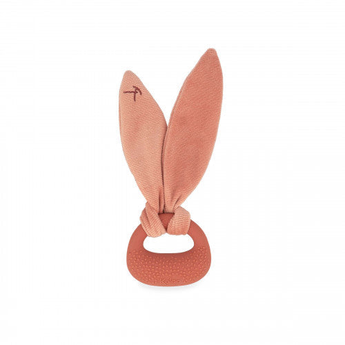 Terracotta baby teether with soft fabric rabbit ears knotted onto a textured silicone ring.
