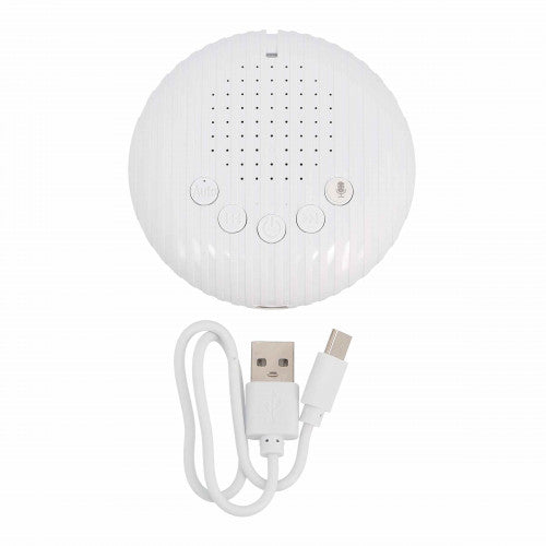 Round white sound module with a central speaker grid, five control buttons, and a white USB charging cable.
