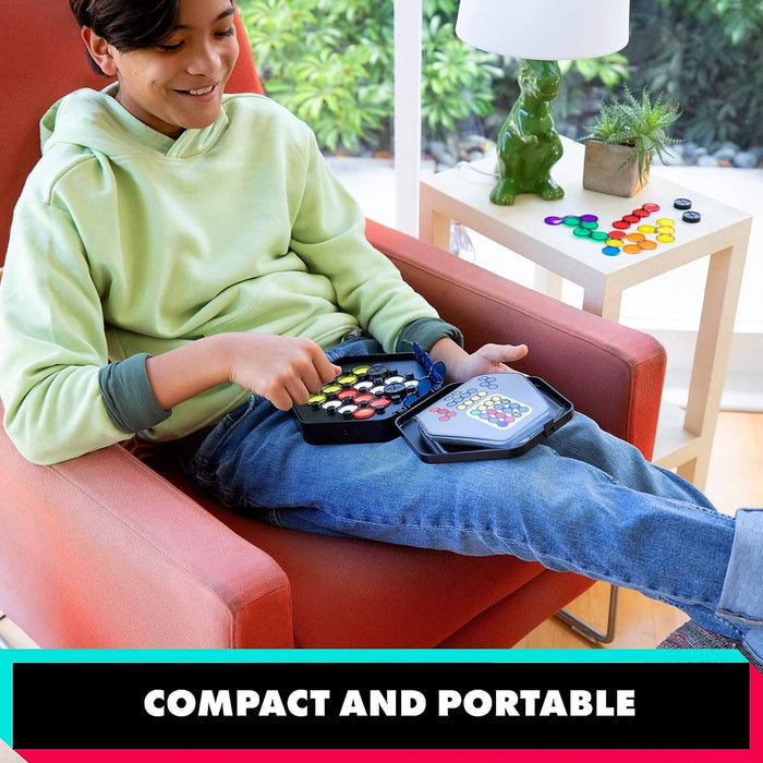 Child playing with colorful translucent circular pieces and challenge cards in a portable black puzzle case.