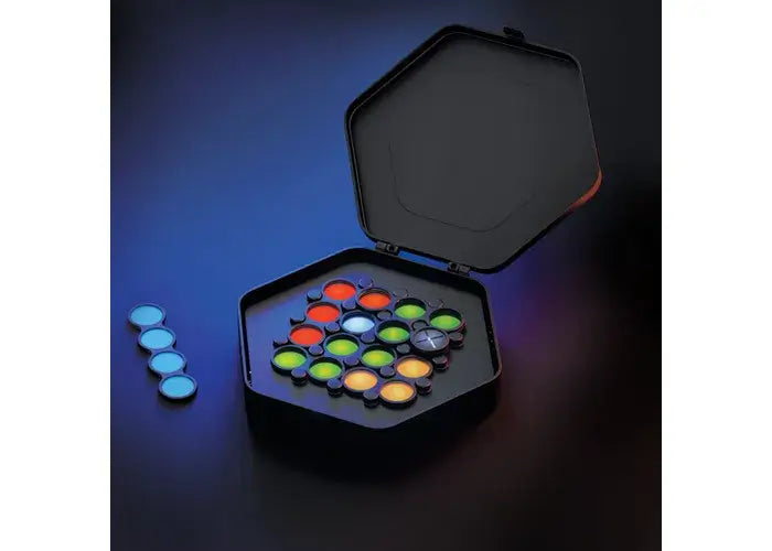 Open black hexagonal case with glowing translucent colorful circular puzzle pieces and four blue pieces on the side.