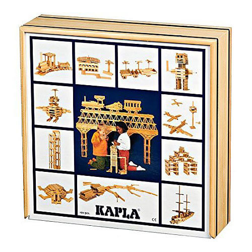 Square wooden box lid featuring a collage of models like a bridge, robot, and boat built from natural wood planks.