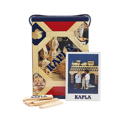 Natural wood blocks next to a navy blue storage bin and a booklet showing children building a wooden bridge.
