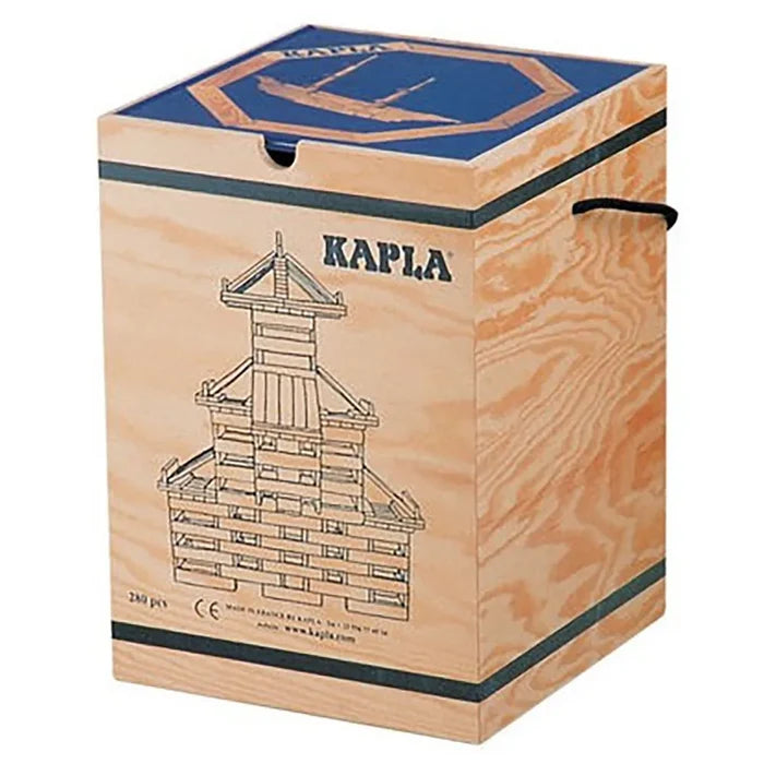 Rectangular wooden storage crate with a blue lid, rope handles, and a black line drawing of a tower on the front.