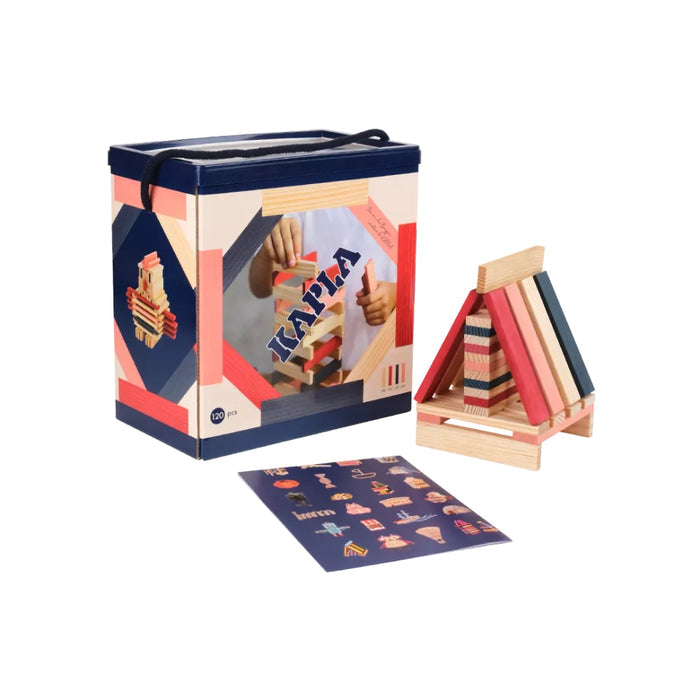 Kapla 120-piece set with blue storage box, pink and navy wooden planks, a built house, and an instruction booklet.