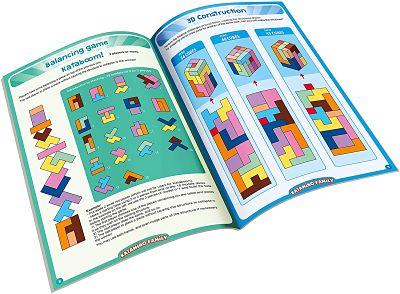 Open instruction booklet showing colorful geometric blocks in balancing and 3D cube building challenges.