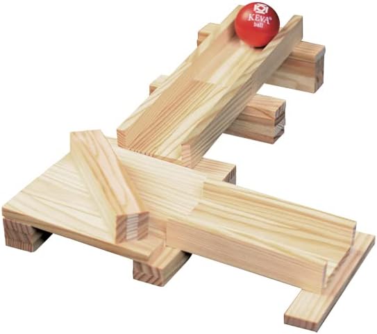 Red ball with KEVA logo on a ramp built from light-colored wooden building planks.