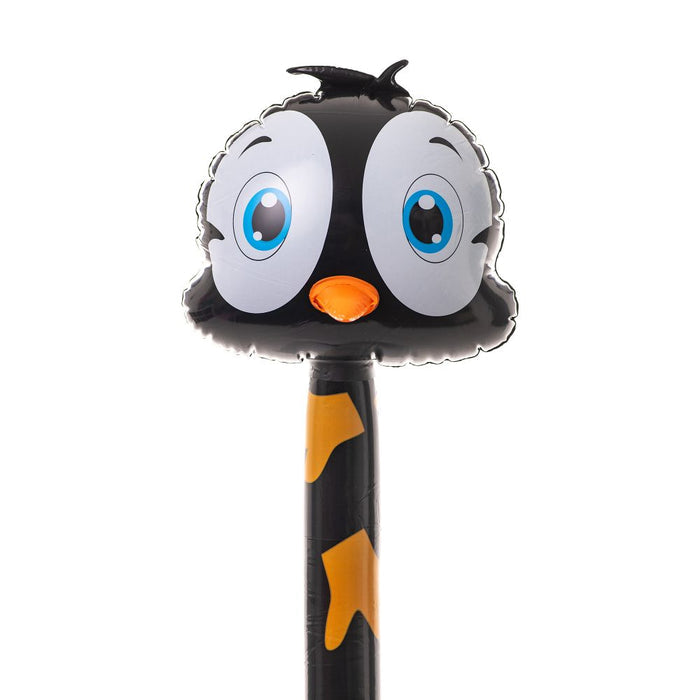 Cartoonish inflatable penguin balloon with large blue eyes and orange beak on a black stick with orange feet patterns.
