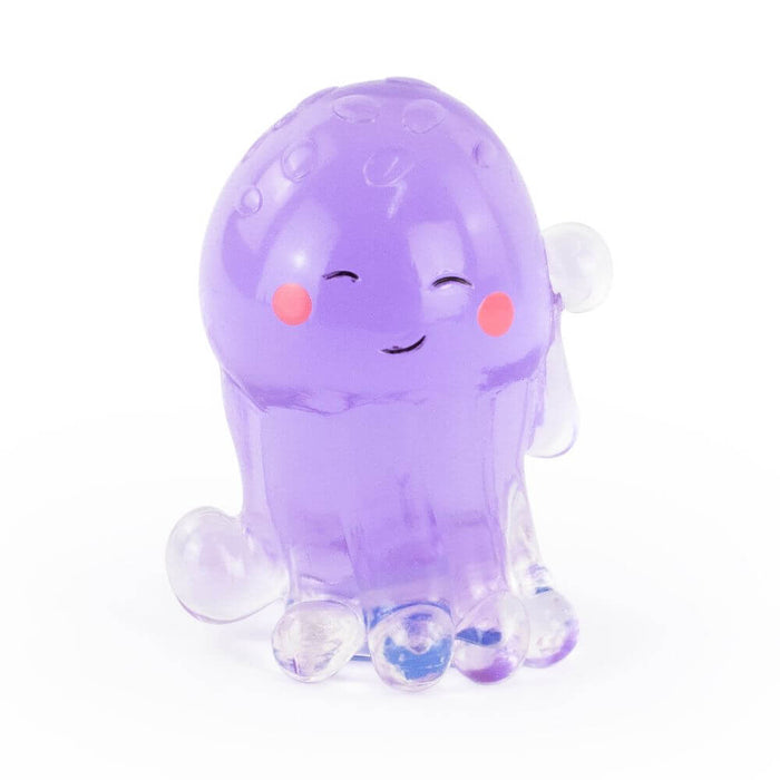 Translucent purple squishy octopus toy with a happy face, pink cheeks, and clear bulbous tentacles.