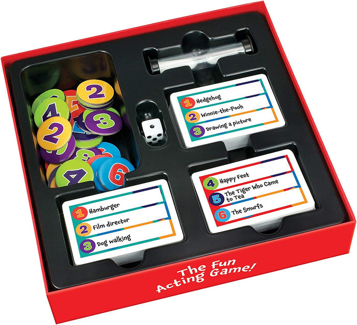 Open red board game box with colorful numbered tokens, a white die, a sand timer, and stacks of charades prompt cards.
