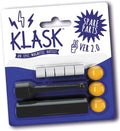 Klask spare parts set with 5 white magnets, 3 yellow balls, and 2 black magnetic striker pieces in a blister pack.