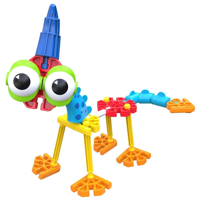 Colorful toy dinosaur with large green eyes, blue horn, yellow legs, and orange webbed feet made from building pieces.