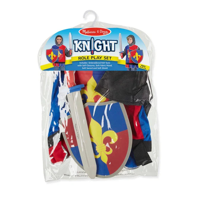 Knight costume in a clear bag with a red and blue tunic, grey foam sword, and shield with a yellow fleur-de-lis.
