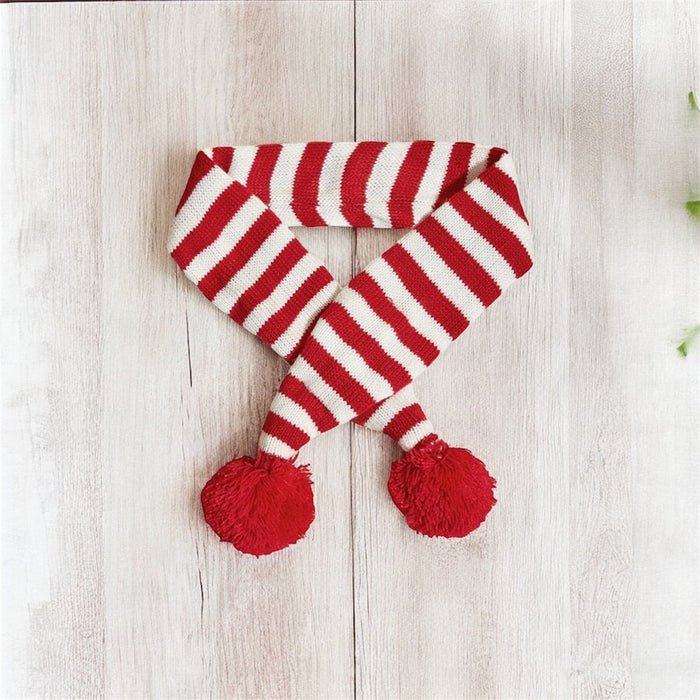 Knitted dog scarf from DogTreatNZ featuring colorful, cozy woolen fabric for small and medium-sized dogs.
