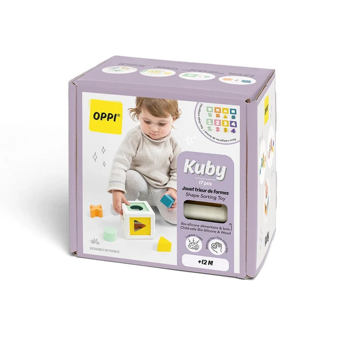 Lavender box for OPPI Kuby shape sorter featuring a child playing with colorful wooden and silicone blocks.