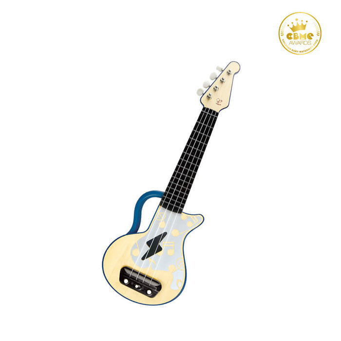 Cream toy ukulele with blue trim, a black lightning bolt graphic, gold musical notes, and four white tuning pegs.