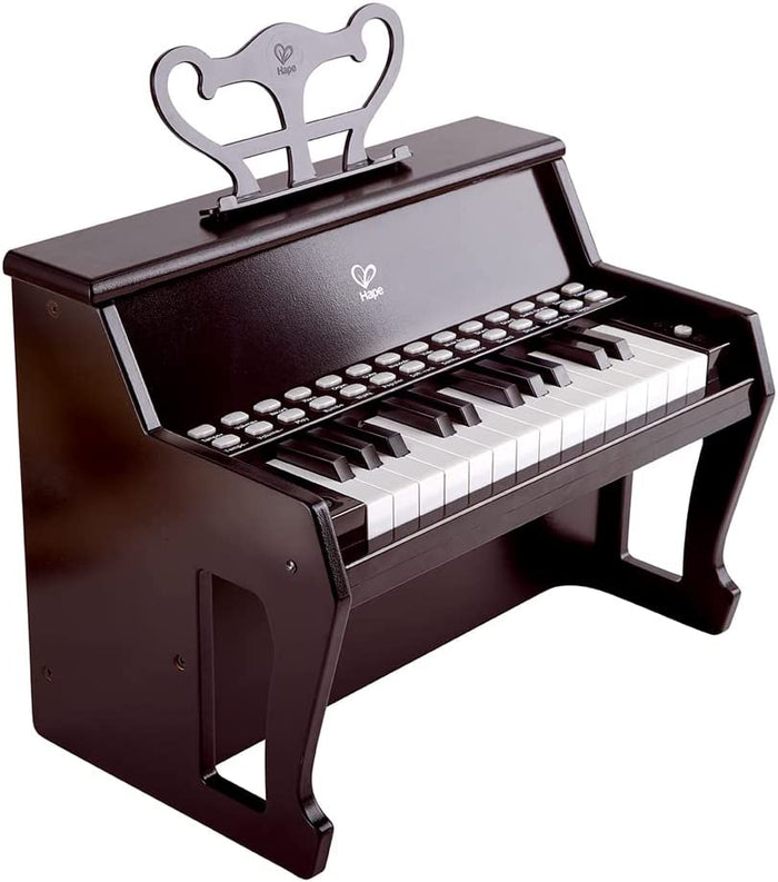 Black toy upright piano with two rows of buttons above white and black keys and a decorative music stand.